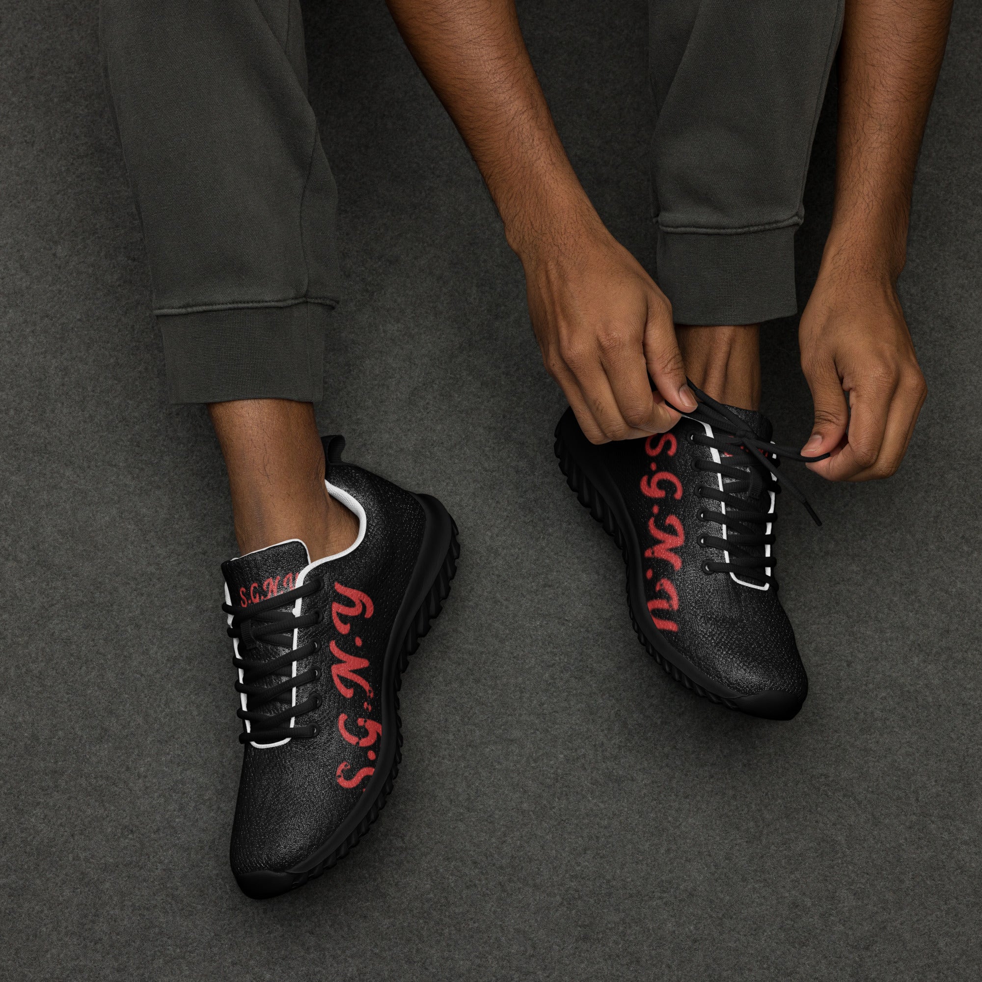 S.G.N.Y Urban Elite mens athletic shoes black with red branding
